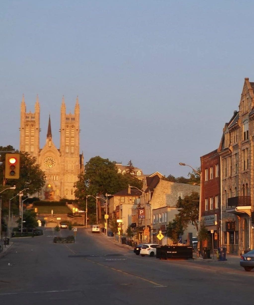 Macdonell Street in evening light, with the Basilica of Our Lady at the top of the hill